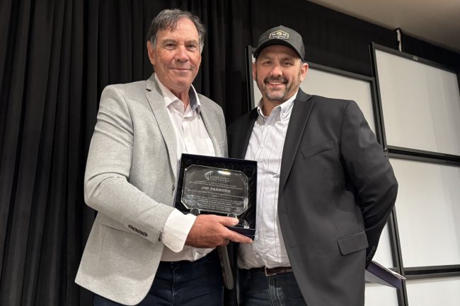 Sean Nepper presents Jim Parsons with the USTFA Clark & Mimi White Distinguished Service Award